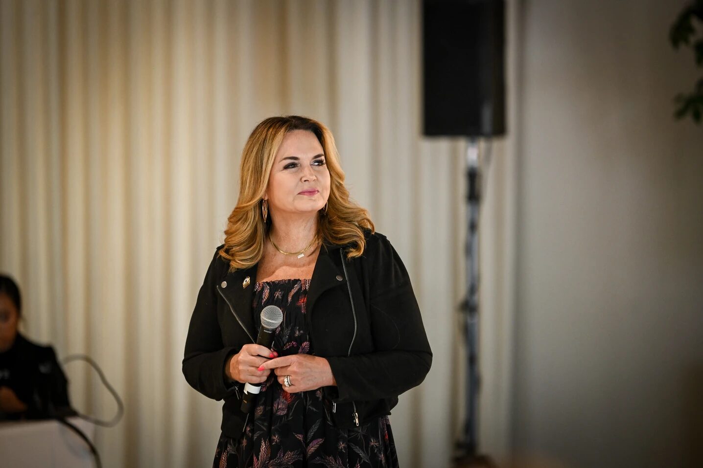 Debra addressing an audience